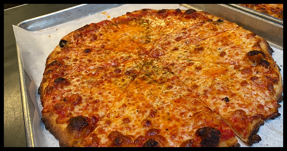 photo of a new haven style pizza with sausage